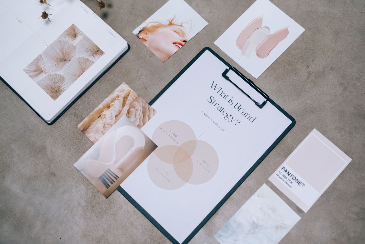 Flat lay presentation of branding materials and design concepts for creative strategy discussions.